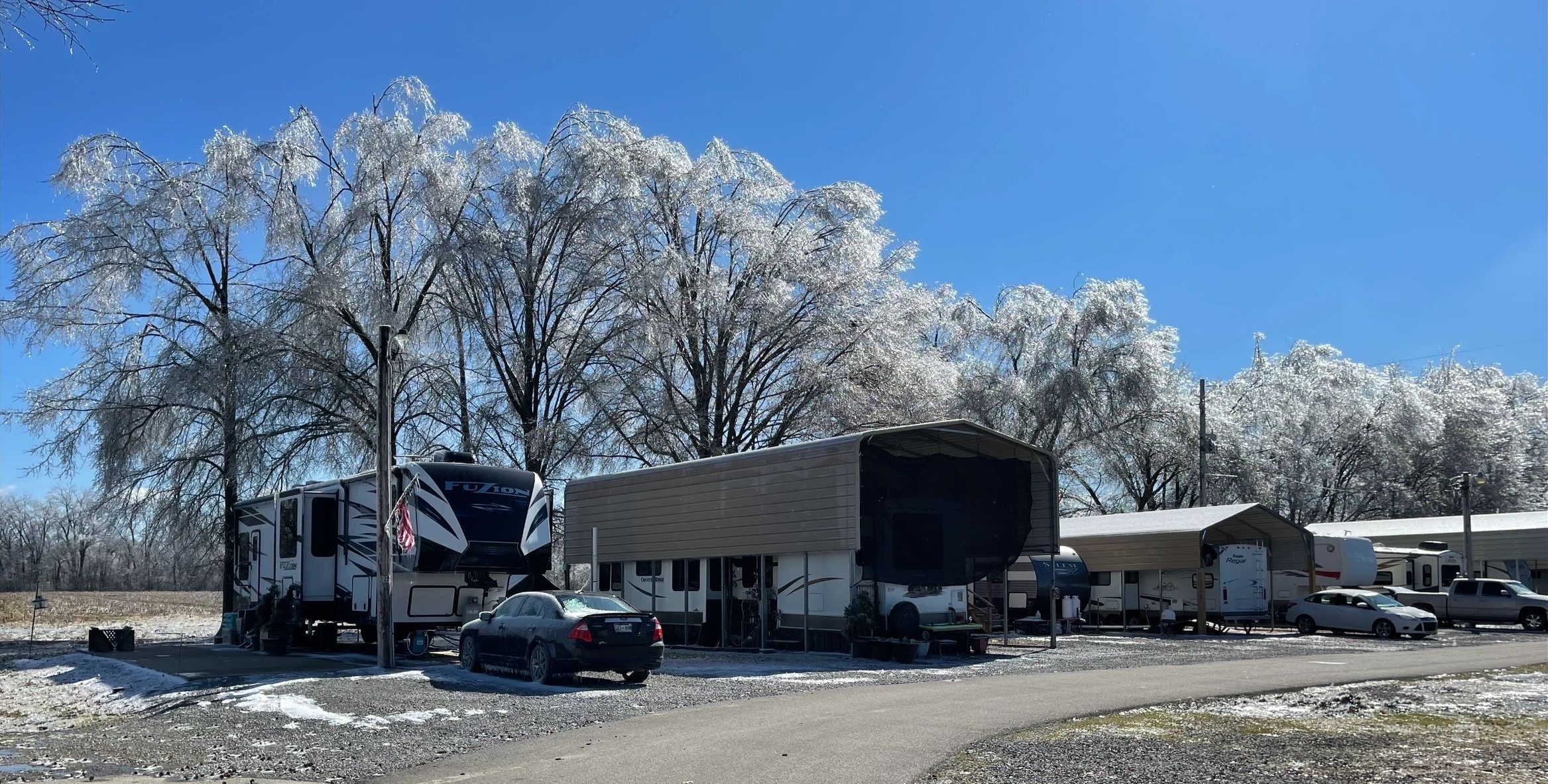 Covered RV sites and paved drives at Casper Creek